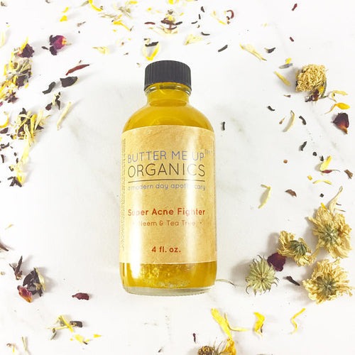 Super Acne Fighter organic acne treatment oil serum in a recyclable glass bottle